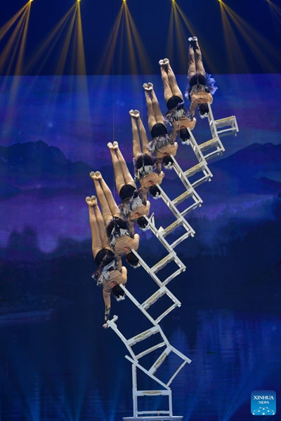 Artists perform during the 11th China Acrobatics Golden Chrysanthemum Awards Competition held in Puyang, central China's Henan Province, Nov. 10, 2022. This award is deemed the highest honor in China for acrobatics. (Xinhua/Li Jianan)