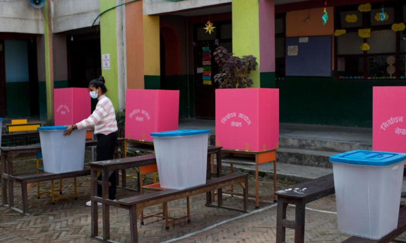 Preparations are made at a polling station ahead of the general elections in Kathmandu, Nepal, Nov. 19, 2022. (Photo by Sulav Shrestha/Xinhua)