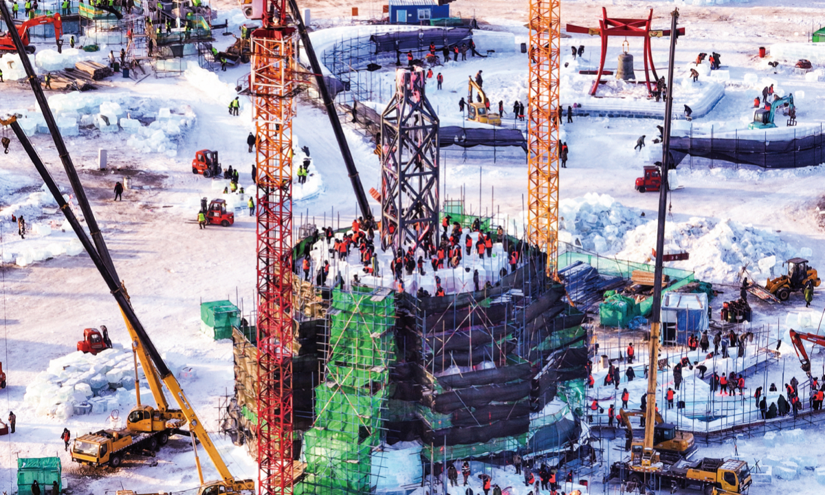 Hundreds of workers build a tower of ice for this year's Harbin Ice and Snow World in Harbin, Northeast China's Heilongjiang Province, on December 8, 2022. One of the most popular winter attractions in the world, the dream-like theme park this year takes 150,000 cubic meters of ice to build. The country's tourism sector is warming up under new measures for COVID-19 response.
