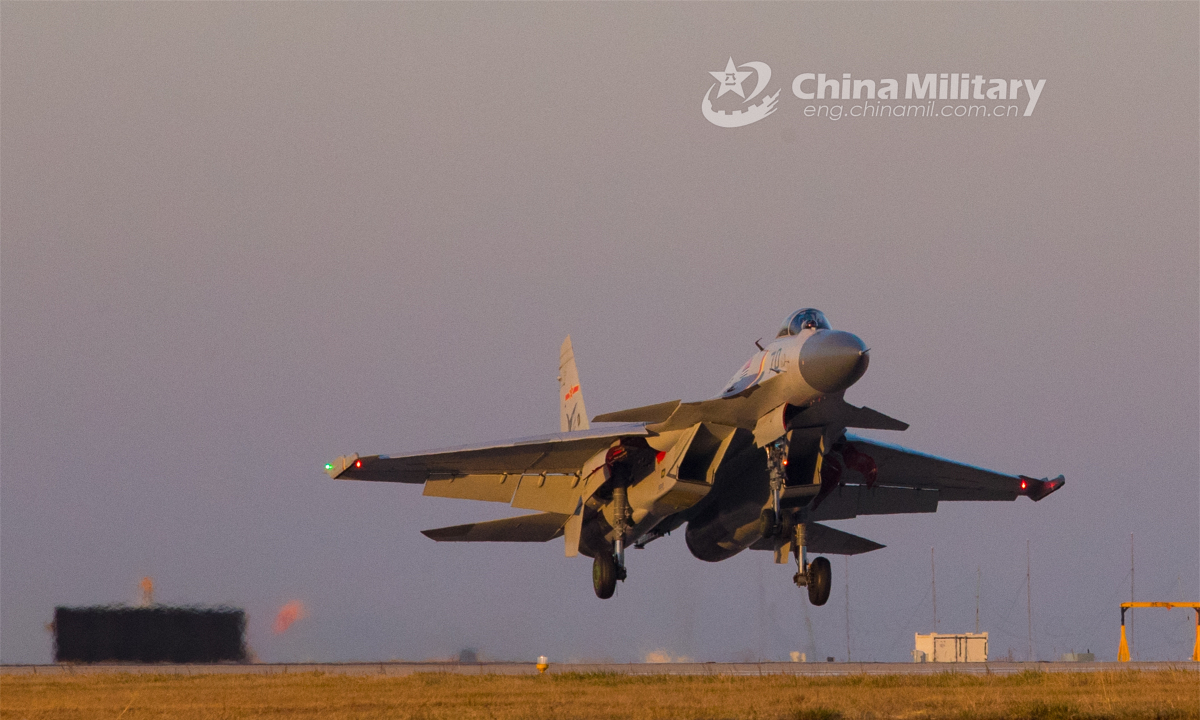 A fighter jet attached to a training base under the PLA Naval Aviation University takes off for a sortie during a flight training course in mid November, 2022. (eng.chinamil.com.cn/Photo by Jiang Tao)