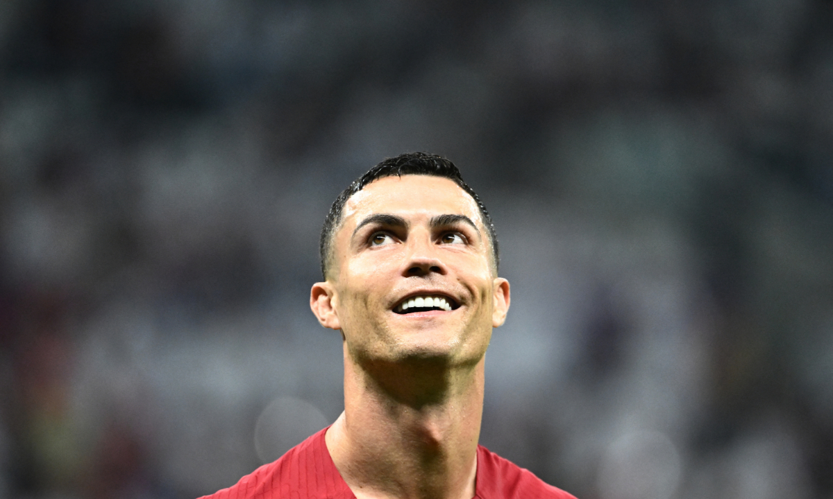 Portugal's forward Cristiano Ronaldo smiles after qualifying to the next round after defeating Switzerland in Lusail, Doha on December 6, 2022. Photo: AFP