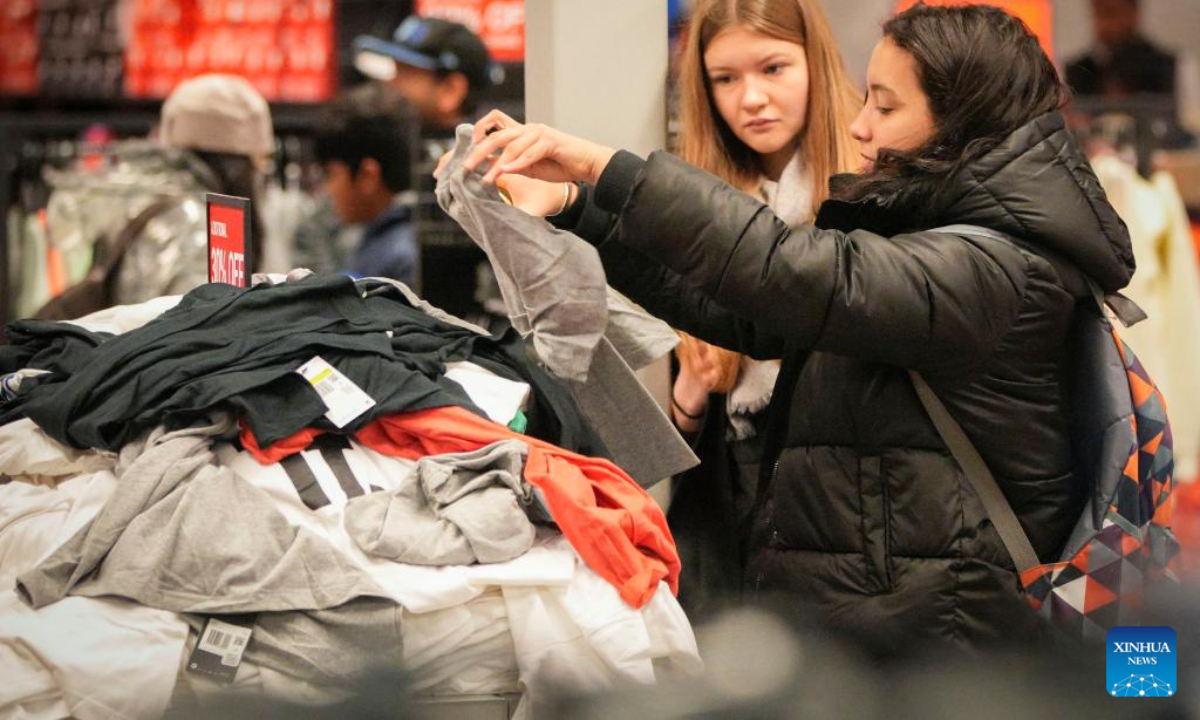 People shop at a store during Black Friday in Vancouver, British Columbia, Canada, on Nov 25, 2022. Photo:Xinhua