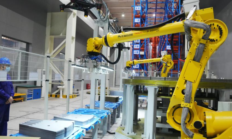 A staff worker works in the factory of Harbin Electric Corporation in Harbin, northeast China's Heilongjiang Province, Nov. 17, 2022. Harbin Electric Corporation, a leading Chinese electric machinery maker in northeast China's Heilongjiang Province, has accelerated digitalization to promote smart production in recent years. (Xinhua/Wang Jianwei)