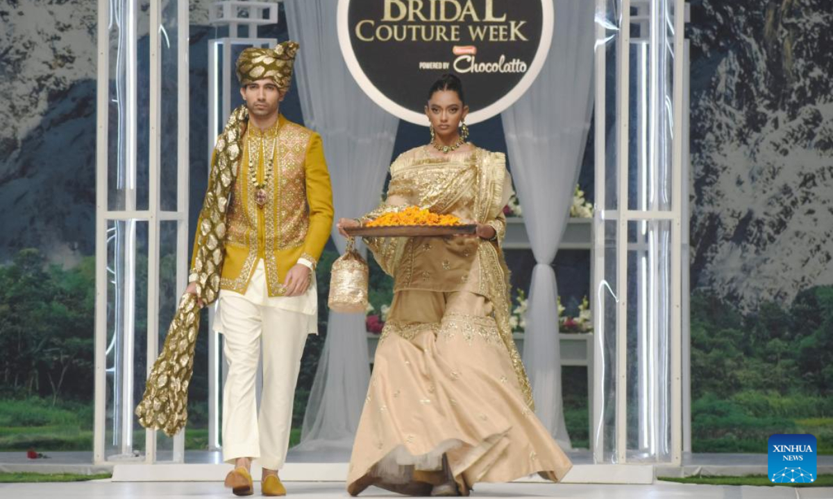 Models present creations during the Bridal Couture Week in Lahore, Pakistan on Dec 16, 2022. Photo:Xinhua
