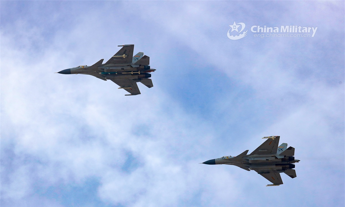 Carrier-based fighter jets attached to a regiment under the PLA Naval Aviation University fly in formation during a real combat flight training exercise on November 16, 2022. (eng.chinamil.com.cn/Photo by Ni Shuai)