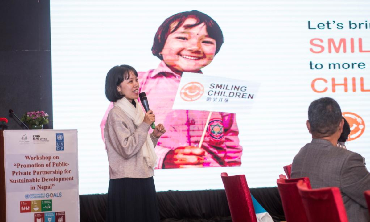 A project manager from the China Foundation for Rural Development (CFRD) elaborates on the Smiling Children Project in Lalitpur, Nepal, Dec 16, 2022. Photo:Xinhua