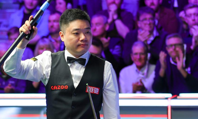 Ding Junhui of China celebrates after the semifinal match against Tom Ford of England at 2022 UK Snooker Championship in York, Britain, Nov. 19, 2022. (Photo by Zhai Zheng/Xinhua)