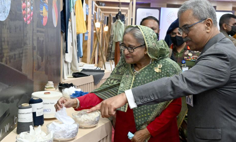 Bangladeshi Prime Minister Sheikh Hasina (L) visits a stall after the inauguration ceremony of Made in Bangladesh Week in Dhaka, Bangladesh, Nov. 13, 2022. Made in Bangladesh Week, the largest-ever apparel event of its kind in the country, kicked off in the Bangladeshi capital Dhaka on Sunday. Photo: Xinhua