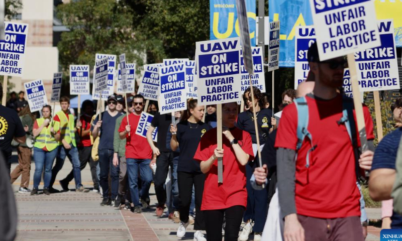 People take part in a protest on campus of the University of California, Los Angeles (UCLA) in Los Angeles, California, the United States, on Nov. 14. 2022. Tens of thousands of academic workers at the University of California (UC) system went on strike Monday for higher wages and better working conditions. Photo: Xinhua