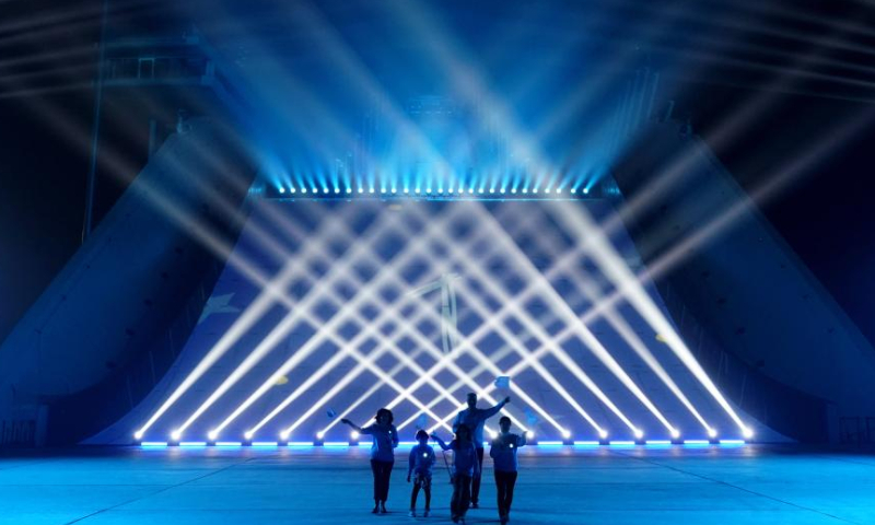 Shougang ski jumping platform is lit up to celebrate World Children's Day in Beijing, capital of China, Nov. 20, 2022. (Xinhua/Zhang Chenlin)