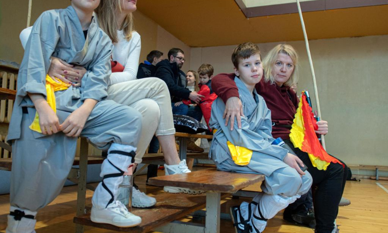 Athletes participate in the 8th Lithuanian Wushu (Kung Fu) Championship in Vilnius, Lithuania, on Dec. 10, 2022. The 8th Lithuanian Wushu (Kung Fu) Championship kicked off on Dec. 10, attracting nearly 100 competitors from Lithuania, Poland, Estonia, India and other countries to take part in. (Photo by Alfredas Pliadis/Xinhua)