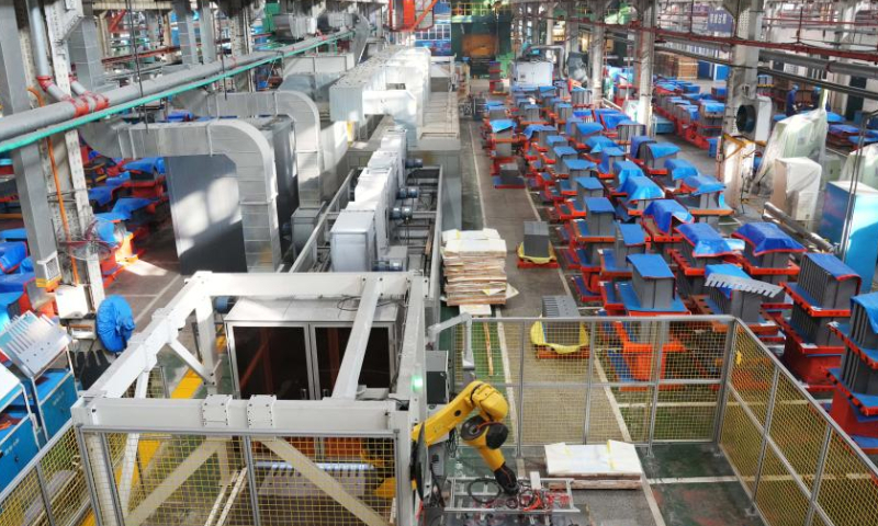 An automatic production line is pictured in the factory of Harbin Electric Corporation in Harbin, northeast China's Heilongjiang Province, Nov. 17, 2022. Harbin Electric Corporation, a leading Chinese electric machinery maker in northeast China's Heilongjiang Province, has accelerated digitalization to promote smart production in recent years. (Xinhua/Wang Jianwei)