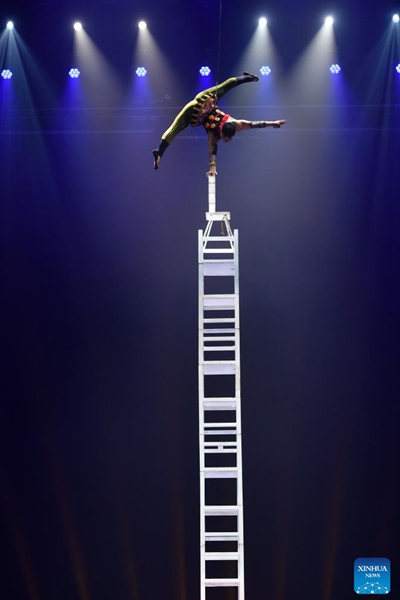 An artist performs during the 11th China Acrobatics Golden Chrysanthemum Awards Competition held in Puyang, central China's Henan Province, Nov. 10, 2022. This award is deemed the highest honor in China for acrobatics. (Xinhua/Li Jianan)