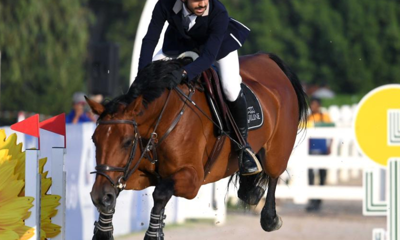 Soud al-Marshoud competes during a jumping show event of Kuwait Equestrian Federation Tour in Mubarak al-Kabeer Governorate, Kuwait, Nov. 26, 2022. (Photo by Ghazy Qaffaf/Xinhua)