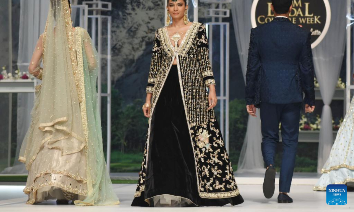 Models present creations during the Bridal Couture Week in Lahore, Pakistan on Dec 16, 2022. Photo:Xinhua