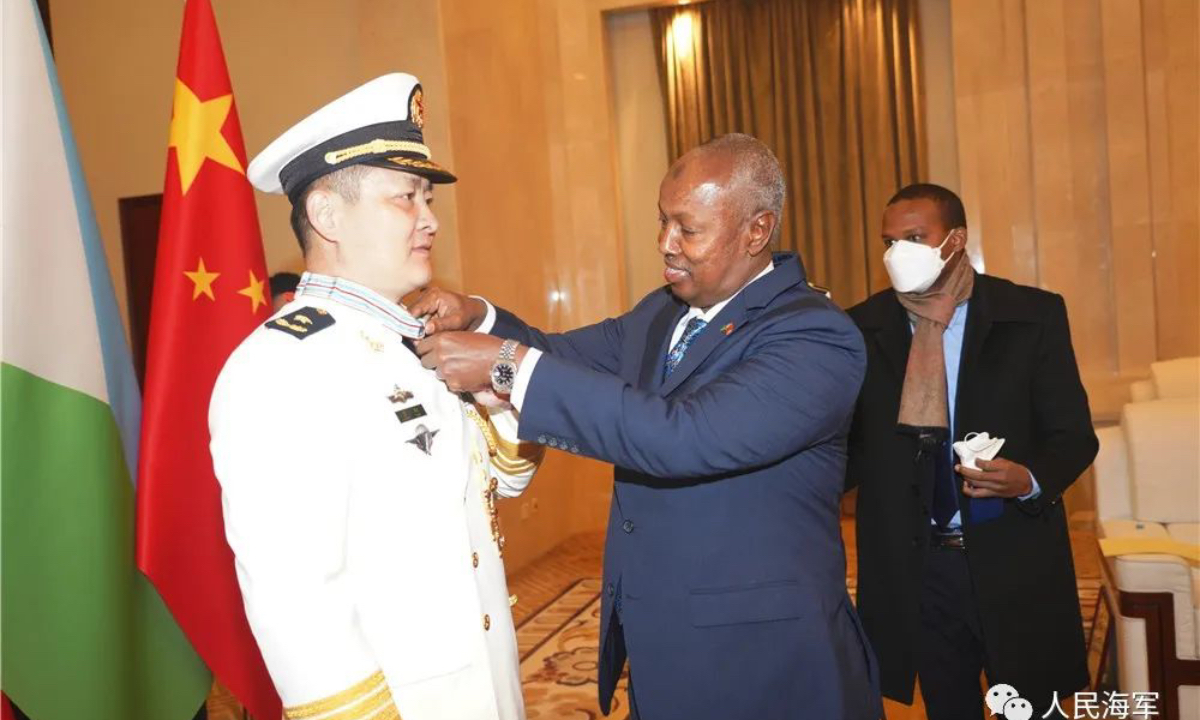 On the morning of December 7, Abdullah Miguil, Djibouti's ambassador to China, on behalf of President Ismail Omar Guelleh of the Republic of Djibouti, awards the Independence Day Medal at the commander level to Rear Admiral Liang Yang who used to be the first commander of the Chinese PLA Support Base in Djibouti. Photo: China Military Online