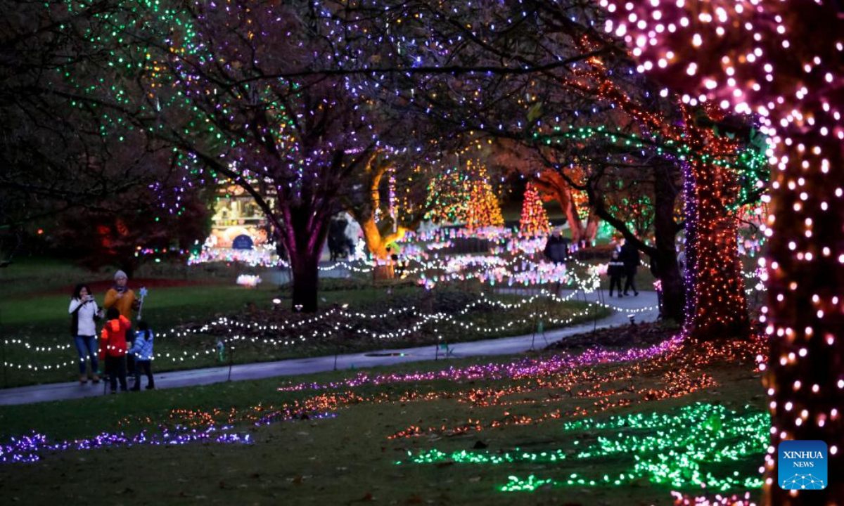 People look at the light decorations at the VanDusen Botanical Garden in Vancouver, British Columbia, Canada, Nov. 25, 2022. Featuring over a million lights in the 6.07-hectare VanDusen Botanical Garden, the 