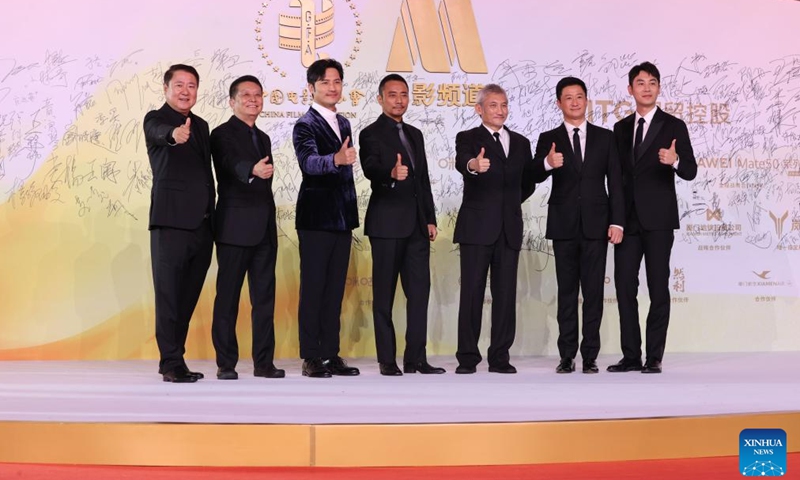 Cast of the film The Battle at Lake Changjin pose at the red carpet ceremony of the 2022 China Golden Rooster and Hundred Flowers Film Festival in Xiamen, southeast China's Fujian Province, Nov. 12, 2022.

The red carpet ceremony of the 2022 China Golden Rooster and Hundred Flowers Film Festival, featuring the 35th China Golden Rooster Awards, was held here on Saturday. (Photo by Zeng Demeng/Xinhua)