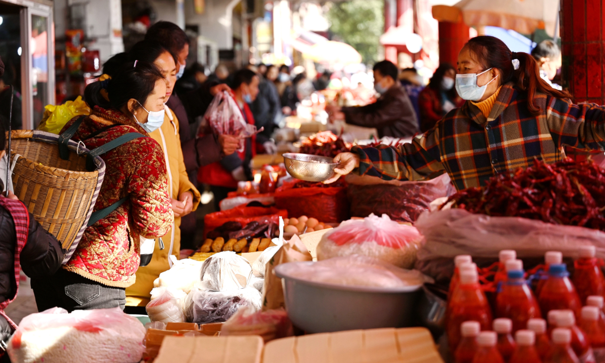 People shop at a market in Qiandongnan Miao and Dong Autonomous Prefecture, Southwest China’s Guizhou Province on December 13, 2022. After the optimization of epidemic prevention and control measures, residents’ work and lives are back to normal. Photo: IC