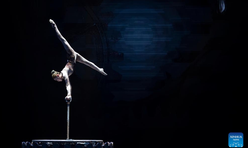 An artist performs during the 11th China Acrobatics Golden Chrysanthemum Awards Competition held in Puyang, central China's Henan Province, Nov. 9, 2022. This award is deemed the highest honor in China for acrobatics. (Xinhua/Xu Jiayi)