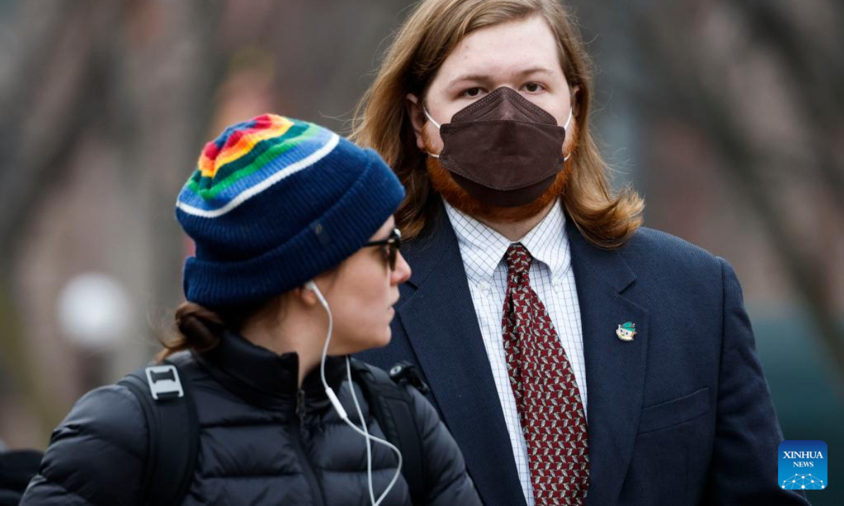 A man wearing a face mask is seen on a street in Washington, DC, the United States, on Dec 16, 2022. Photo:Xinhua