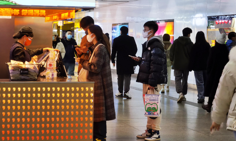 Residents go shopping at a shopping mall in Nanjing, East China's Jiangsu Province, on December 11, 2022. Consumption gradually resumed after the release of optimized COVID-19 response measures. Photo: VCG