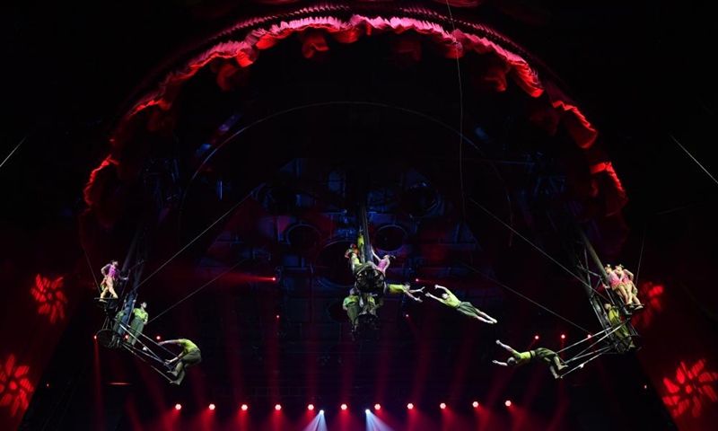 Artists perform during the 11th China Acrobatics Golden Chrysanthemum Awards Competition held in Puyang, central China's Henan Province, Nov. 10, 2022. This award is deemed the highest honor in China for acrobatics. (Xinhua/Li Jianan)