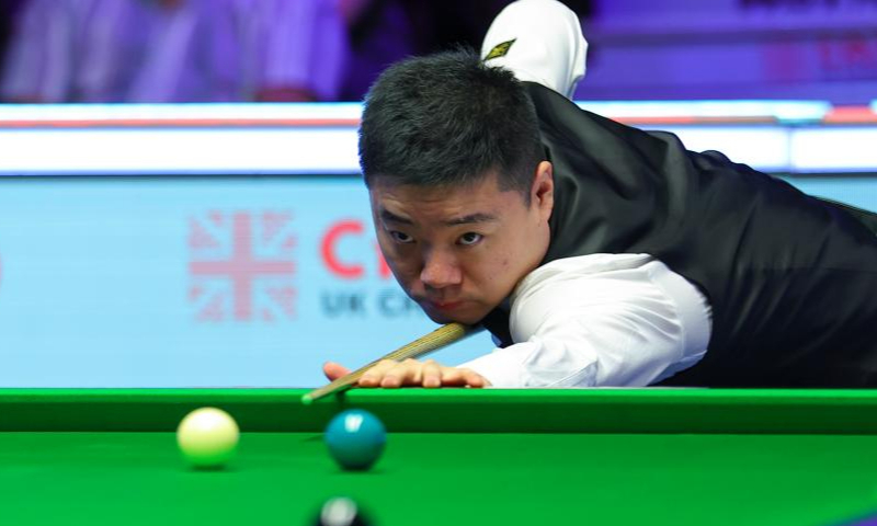 Ding Junhui of China competes during the semifinal match against Tom Ford of England at 2022 UK Snooker Championship in York, Britain, Nov. 19, 2022. (Photo by Zhai Zheng/Xinhua)