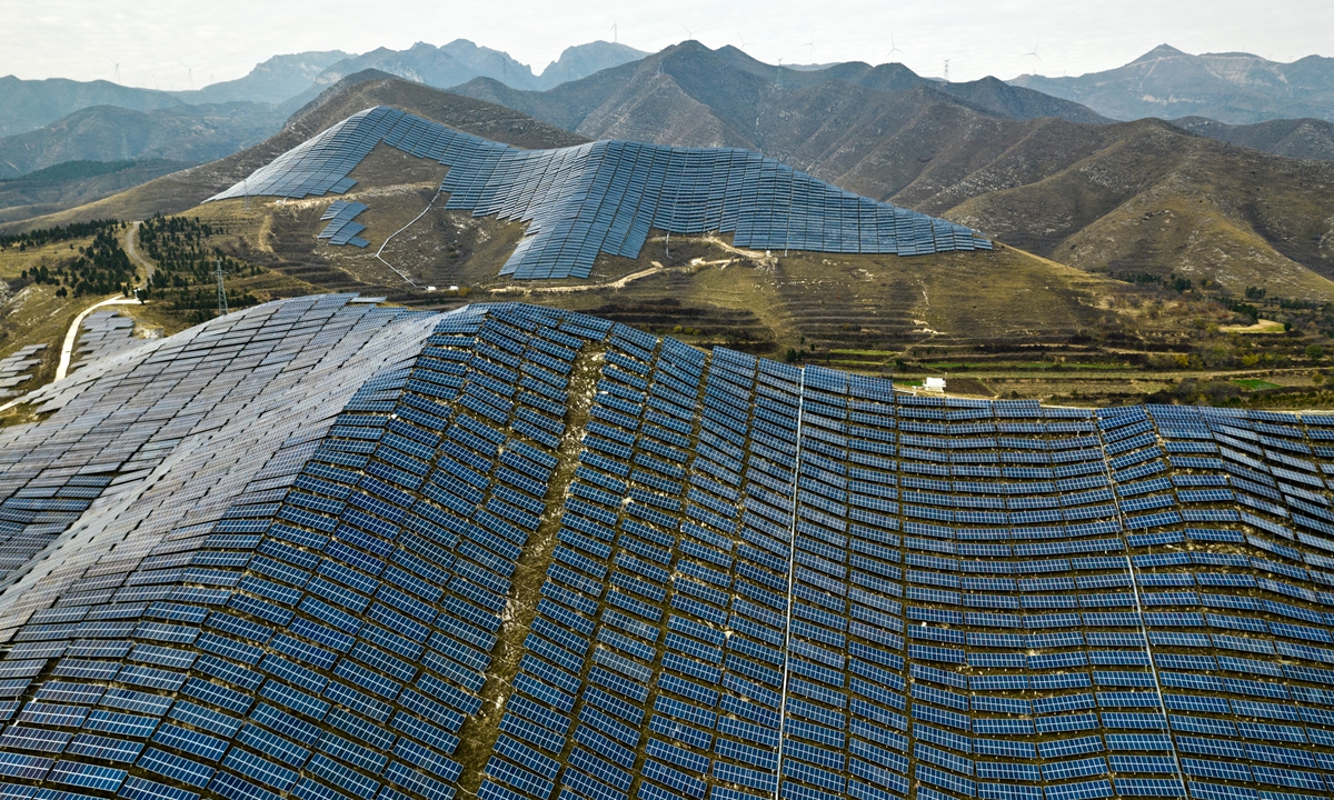 Photovoltaic (PV) panels are arranged at a PV technology base on a barren mountain in Ruicheng county, North China's Shanxi Province on November 13, 2022. Ruicheng has stepped up efforts to develop PV power generation in recent years, delivering green energy to households. Photo: VCG