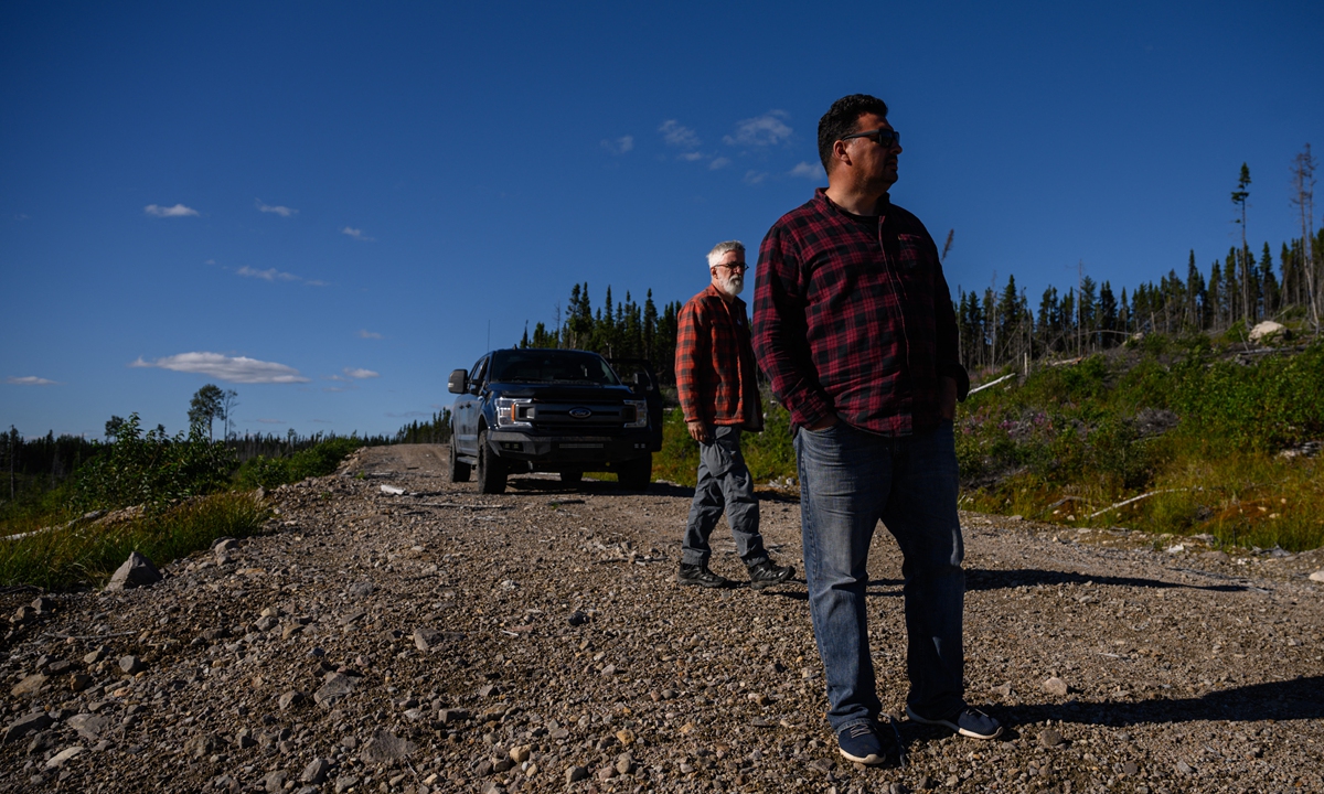 Ecologist and research scientist Louis de Grandpre (left) walks with indigenous Innu caribou researcher Jean-Luc Kanape as they look for caribous in the Canadian boreal forest in Quebec, Canada earlier in 2022. Photo: AFP
