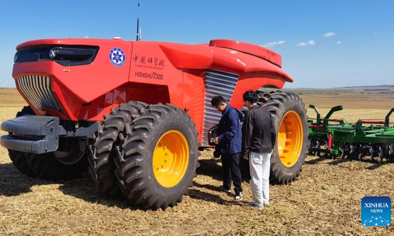 This photo taken on Sept. 16, 2022 shows an unmanned tractor in the Dahewan Demonstration Zone in Hulun Buir City of north China's Inner Mongolia Autonomous Region. (Xinhua/Zou Jianpu)