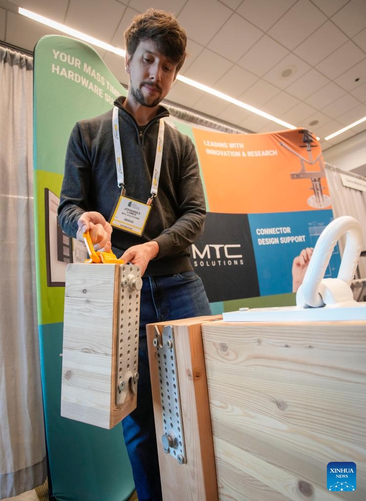 An exhibitor displays hardware for wood construction at an exhibition hall during the Wood Solutions Conference in Vancouver, British Columbia, Canada, on Nov. 15, 2022.Photo: Xinhua