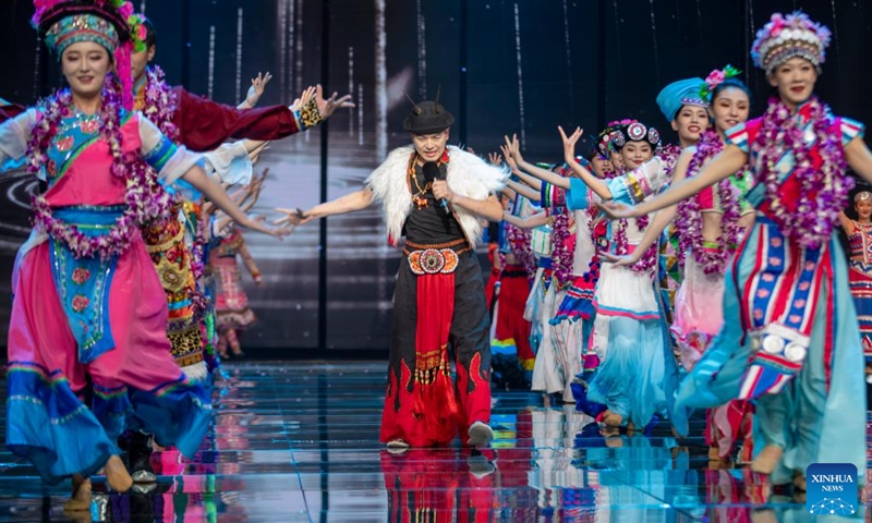 Entertainers perform during the opening ceremony of an ethnic clothing festival held in Kunming, southwest China's Yunnan Province, Nov. 15, 2022. Creations from different ethnic groups of Yunnan will be presented during the ethnic clothing festival. (Xinhua/Chen Xinbo)