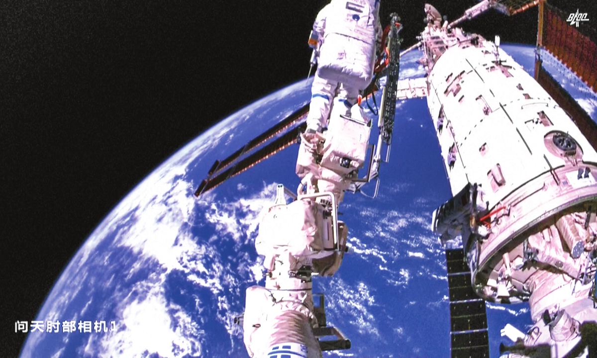 Screenshot of a video shows Shenzhou-14 mission commander Chen Dong and his fellow crew member Cai Xuzhe conducting extravehicular activity on November 17, 2022. At 4:50 pm Beijing time on the day, the Shenzhou-14 taikonauts completed all the tasks set for their third spacewalk. Photo: China Manned Space Agency
