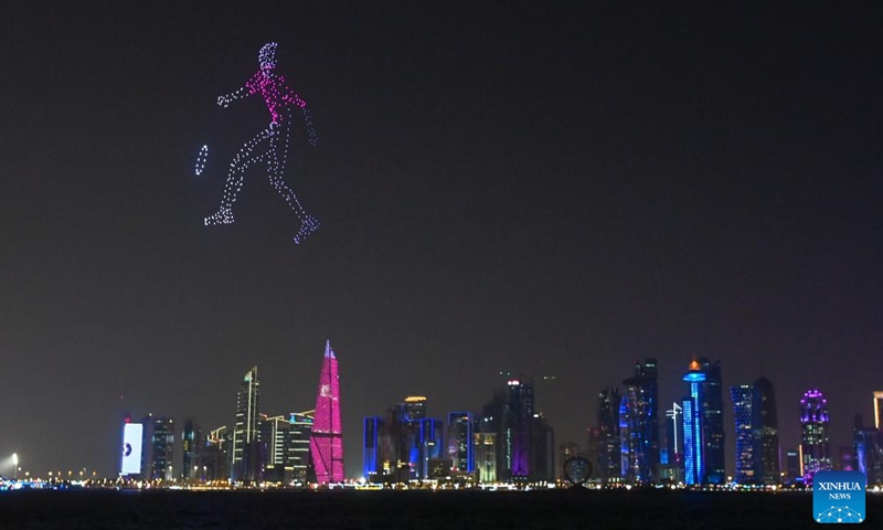 This photo taken on Nov. 19, 2022 shows the drone performance on the opening ceremony of the FIFA Fan Festival in Doha, Qatar. (Photo by Nikku/Xinhua)