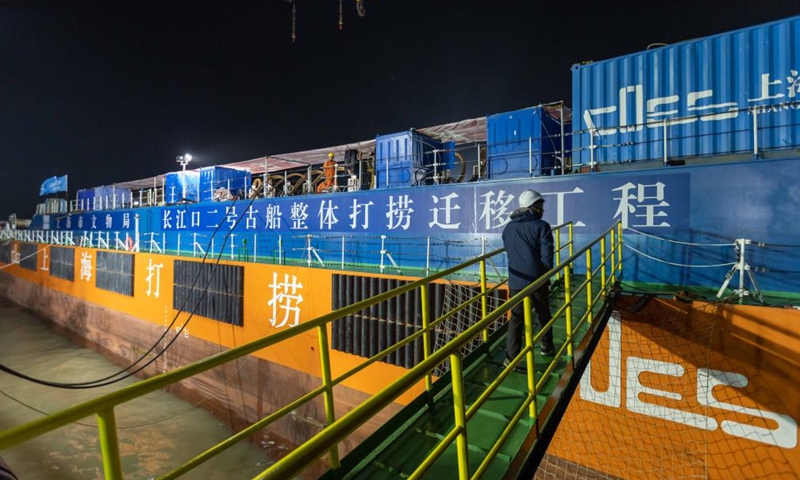 This photo taken on Nov. 20, 2022 shows a view of the salvage operation of the Yangtze No. 2 Ancient Shipwreck in Shanghai, east China. An ancient shipwreck, one of the largest and best-preserved wooden shipwrecks discovered underwater in China to date, was lifted out of waters in Shanghai early Monday.