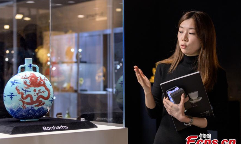 A rare imperial turquoise-ground underglaze-blue and copper-red dragon moonflask of the Emperor Qianlong (1736-1796) of Qing Dynasty is on display at Hong Kong's Bonhams, Nov. 21, 2022. (Photo: China News Service/Suo Youwei)