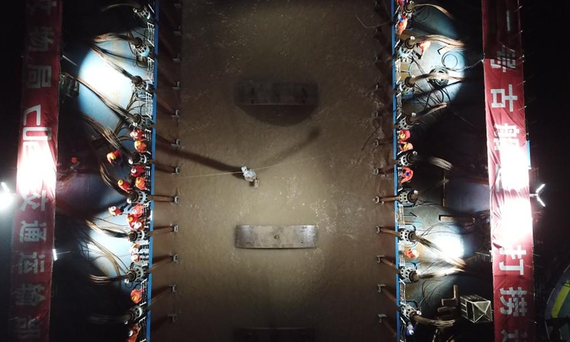 This aerial photo taken on Nov. 21, 2022 shows a view of the salvage operation of the Yangtze No. 2 Ancient Shipwreck in Shanghai, east China. An ancient shipwreck, one of the largest and best-preserved wooden shipwrecks discovered underwater in China to date, was lifted out of waters in Shanghai early Monday.