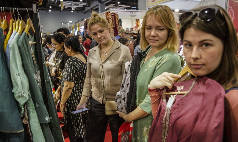 People buy clothes during India International Trade Fair 2022 in New Delhi, India, Nov. 22, 2022. (Xinhua/Javed Dar)