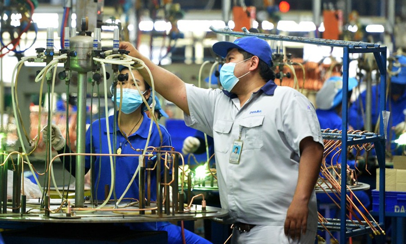 A staff member Natawut Lorboon works at the production line of Dunan Metals (Thailand) Co., Ltd, in the Thai-Chinese Rayong industrial zone in Rayong Province, Thailand, Nov. 8, 2022. (Xinhua/Rachen Sageamsak)