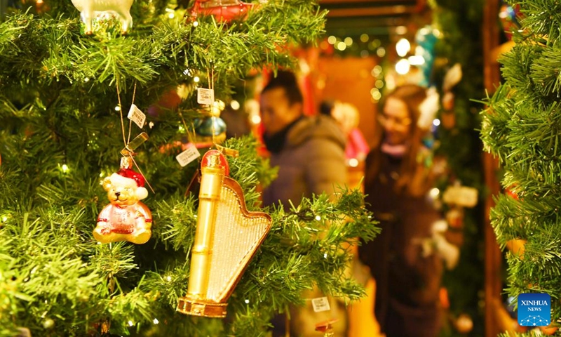 People visit the Christmas market on Alexanderplatz in Berlin, Germany, Nov. 22, 2022. (Xinhua/Ren Pengfei)