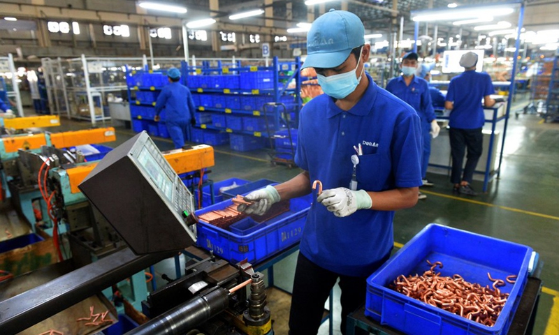 A staff member works at the production line of Dunan Metals (Thailand) Co., Ltd, in the Thai-Chinese Rayong industrial zone in Rayong Province, Thailand, Nov. 8, 2022. (Xinhua/Rachen Sageamsak)