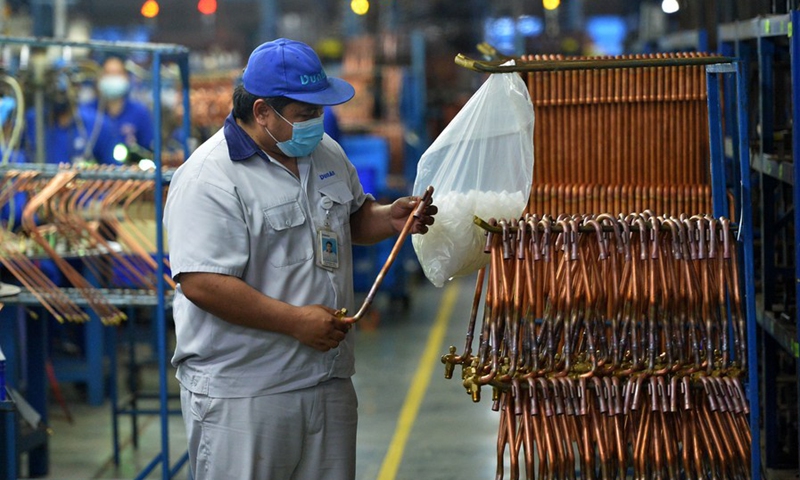 A staff member Natawut Lorboon works at the production line of Dunan Metals (Thailand) Co., Ltd, in the Thai-Chinese Rayong industrial zone in Rayong Province, Thailand, Nov. 8, 2022. (Xinhua/Rachen Sageamsak)