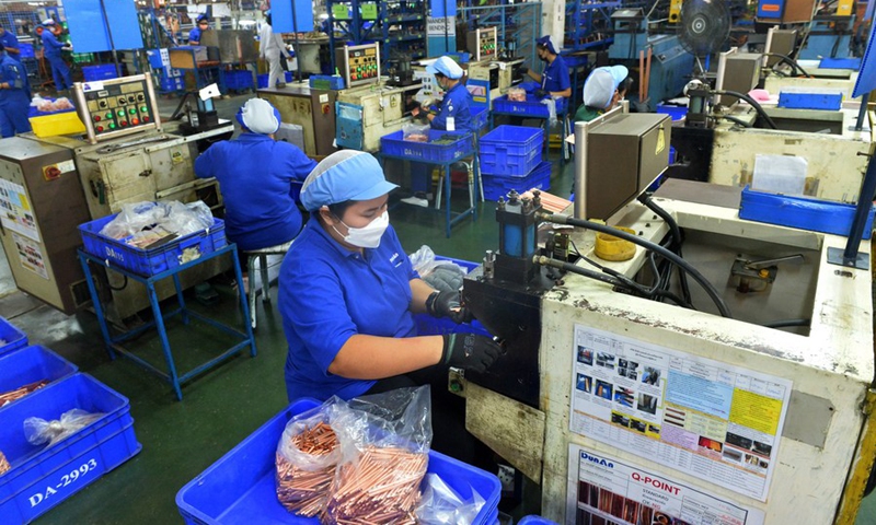 Staff members work at the production line of Dunan Metals (Thailand) Co., Ltd, in the Thai-Chinese Rayong industrial zone in Rayong Province, Thailand, Nov. 8, 2022. (Xinhua/Rachen Sageamsak)