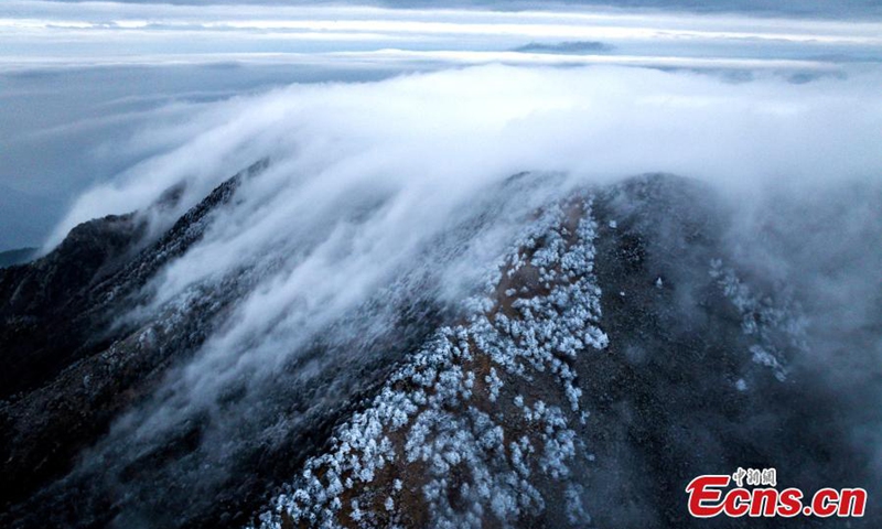 Winter sunrise shines on the mountain peak in Zhuque National Forest Park in Xi'an, northwest China's Shaanxi Province, Nov. 22, 2022, turning it into a white fairyland. (Photo: China News Service/Cheng Wenying)