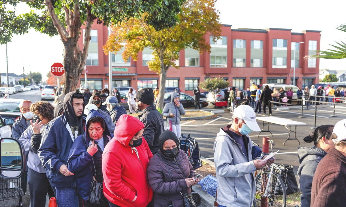 People in need wait in line during the Bay Area Rescue Mission's annual turkey giveaway on November 22, 2022 in Richmond, California. The Bay Area Rescue Mission delivered Thanksgiving turkeys and meal ingredients to an estimated 800 families at their annual Thanksgiving turkey giveaway. Photo: VCG