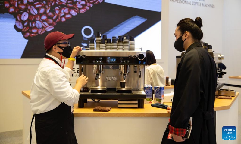 A visitor learns about products on exhibit during the 2022 Seoul International Cafe Show in Seoul, South Korea, Nov. 23, 2022. The 2022 Seoul International Cafe Show kicked off in Seoul on Wednesday. (Xinhua/Wang Yiliang)