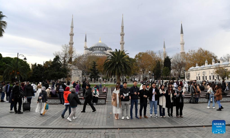 Tourists are seen near Sultanahmet Square in Istanbul, Türkiye, Nov. 23, 2022. More than 4.8 million foreign visitor arrivals were registered in Türkiye in October, up by 38.3 percent year on year, official statistics showed on Monday. (Xinhua/Shadati)