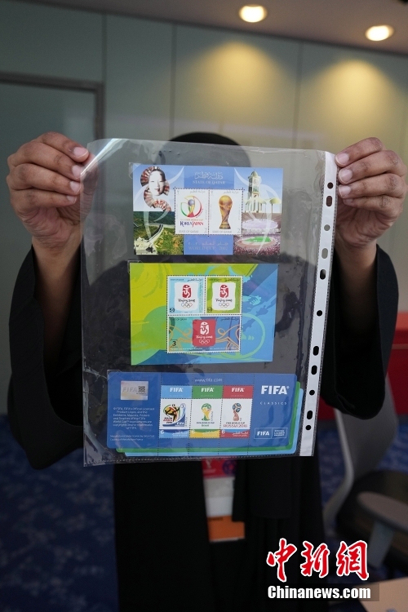 A set of commemorative stamps of Beijing 2008 Summer Olympic Games is on display at the main media center for the FIFA World Cup 2022 in Doha, Qatar, Nov. 23, 2022. The set of stamps, a FIFA classics collection stamps, costs 6 Riyal. (Photo: China News Service/Cui Nan)