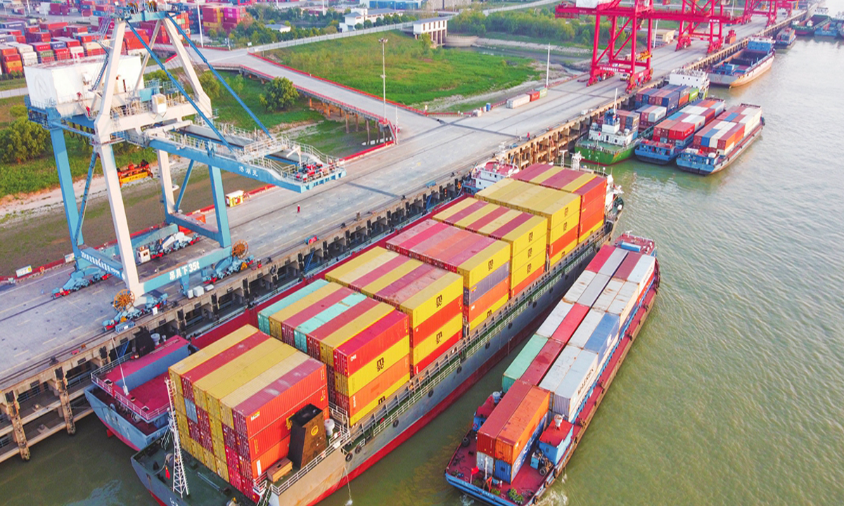 Cargo ships load at Wuhu Port in East China's Anhui Province on November 5, 2022. Bulk cargo throughput reached 17.34 million tons in the first nine months this year, up 18 percent year-on-year, while container shipment rose 14.6 percent to hit 935,300 containers in the first three quarters. Photo: cnsphoto